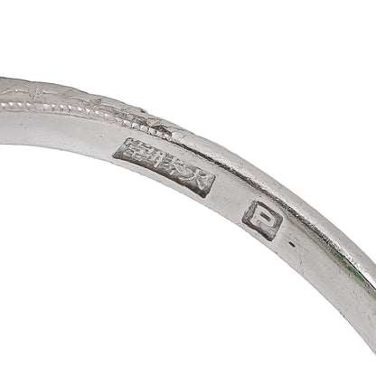 Close-up of a Chinese stamp inside a platinum ring shank