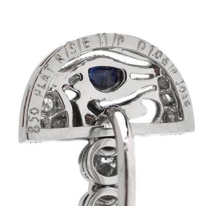 A pair of Eye of Horus drop earrings set with diamonds, rubies, emeralds, blue sapphires and yellow sapphires, in platinum