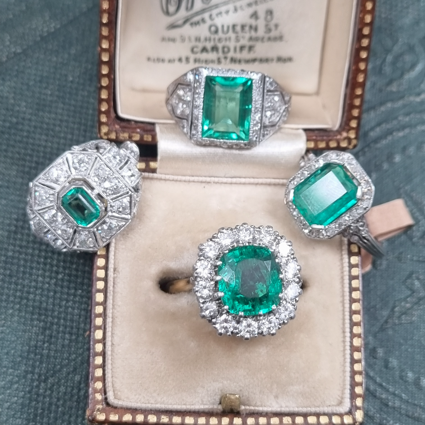 Vintage Art Deco Emerald and Diamond Cluster Engagement Ring