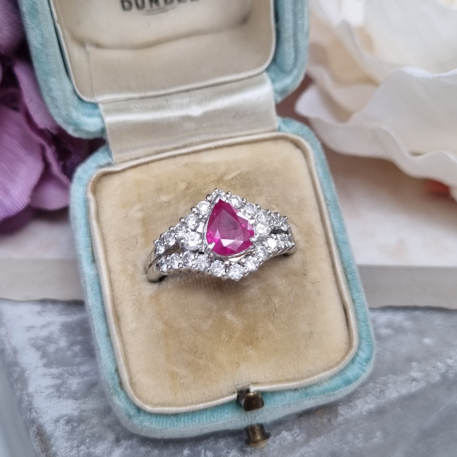 1ct Pear Cut Ruby and Diamond Cluster Engagement Ring in Platinum