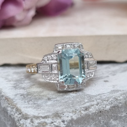 2.34ct Emerald Cut Aquamarine and Diamond Cluster Engagement Ring in 18ct White and Yellow Gold