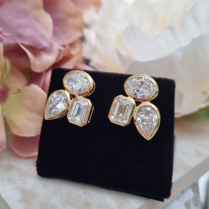 Stylish Pear Oval and Emerald Cut Diamond Earrings