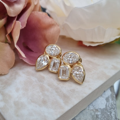 Stylish Pear Oval and Emerald Cut Diamond Earrings