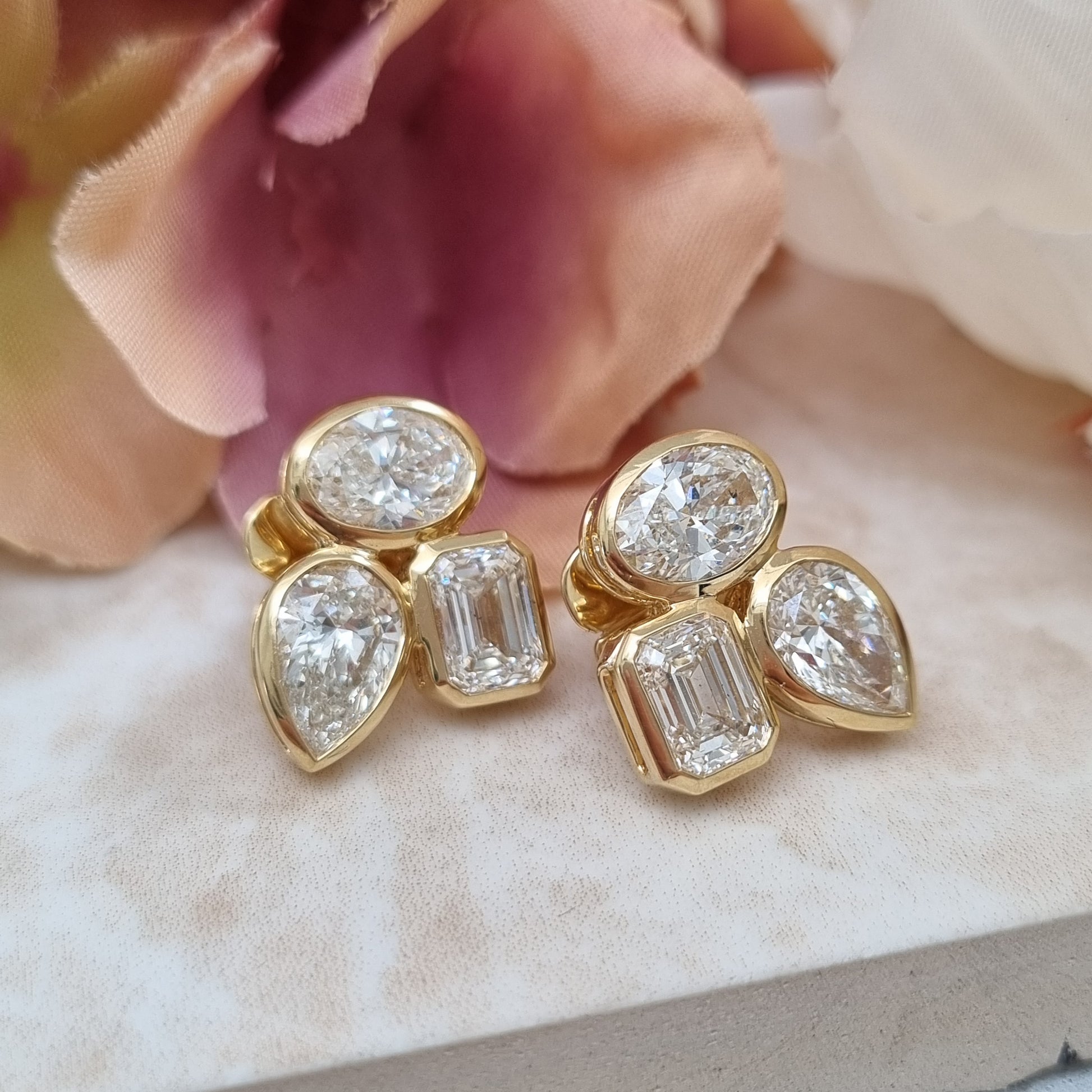 Fine Pair of Pear Oval and Emerald Cut Diamond Earrings