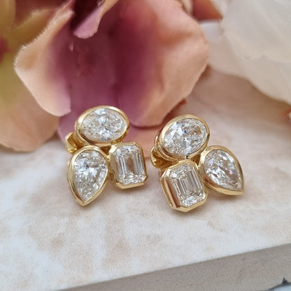 Fine Pair of Pear Oval and Emerald Cut Diamond Earrings