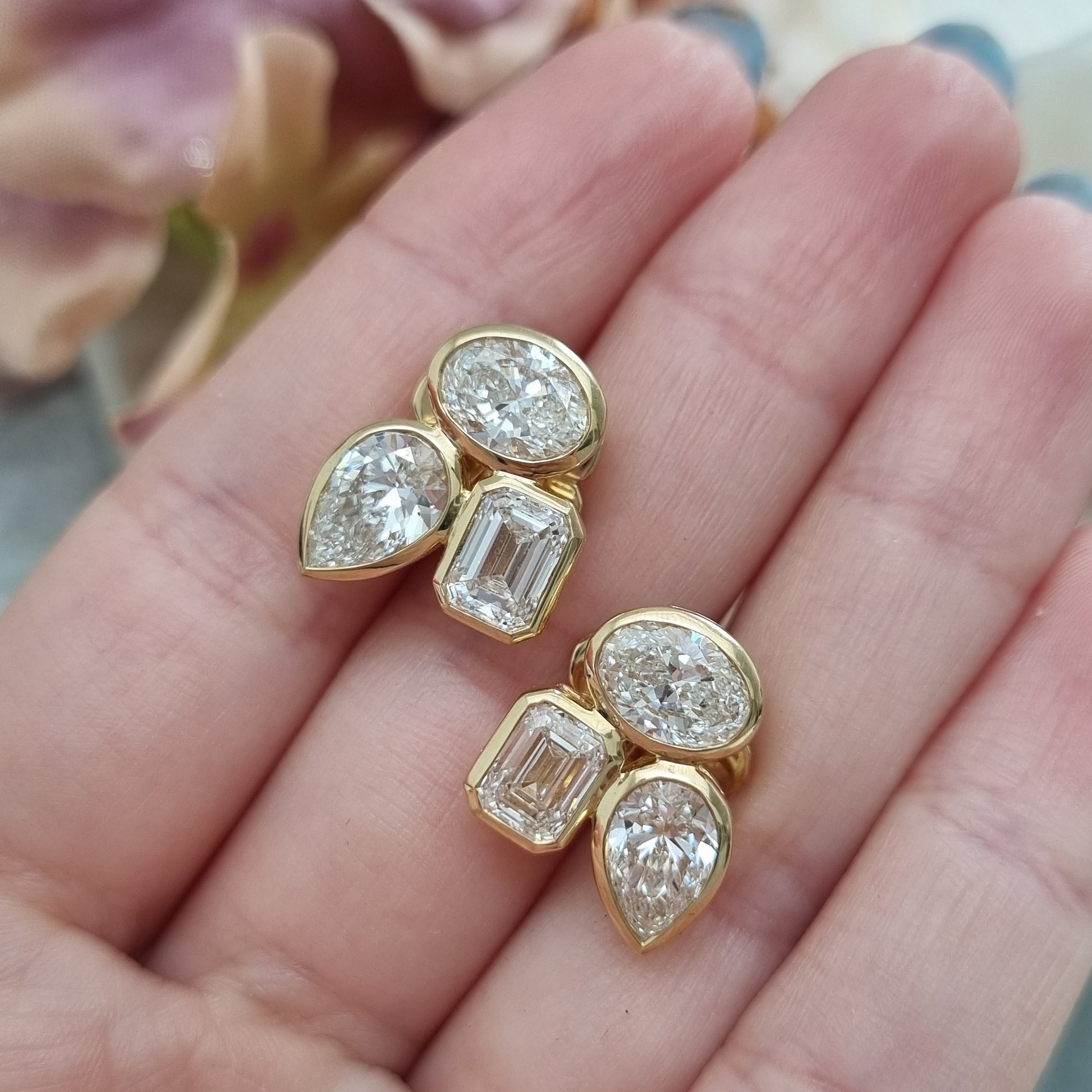 Fine Pair of Pear Oval and Emerald Cut Diamond Earrings
