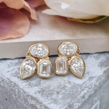 Stylish Pear Oval and Emerald Cut Diamond Earrings