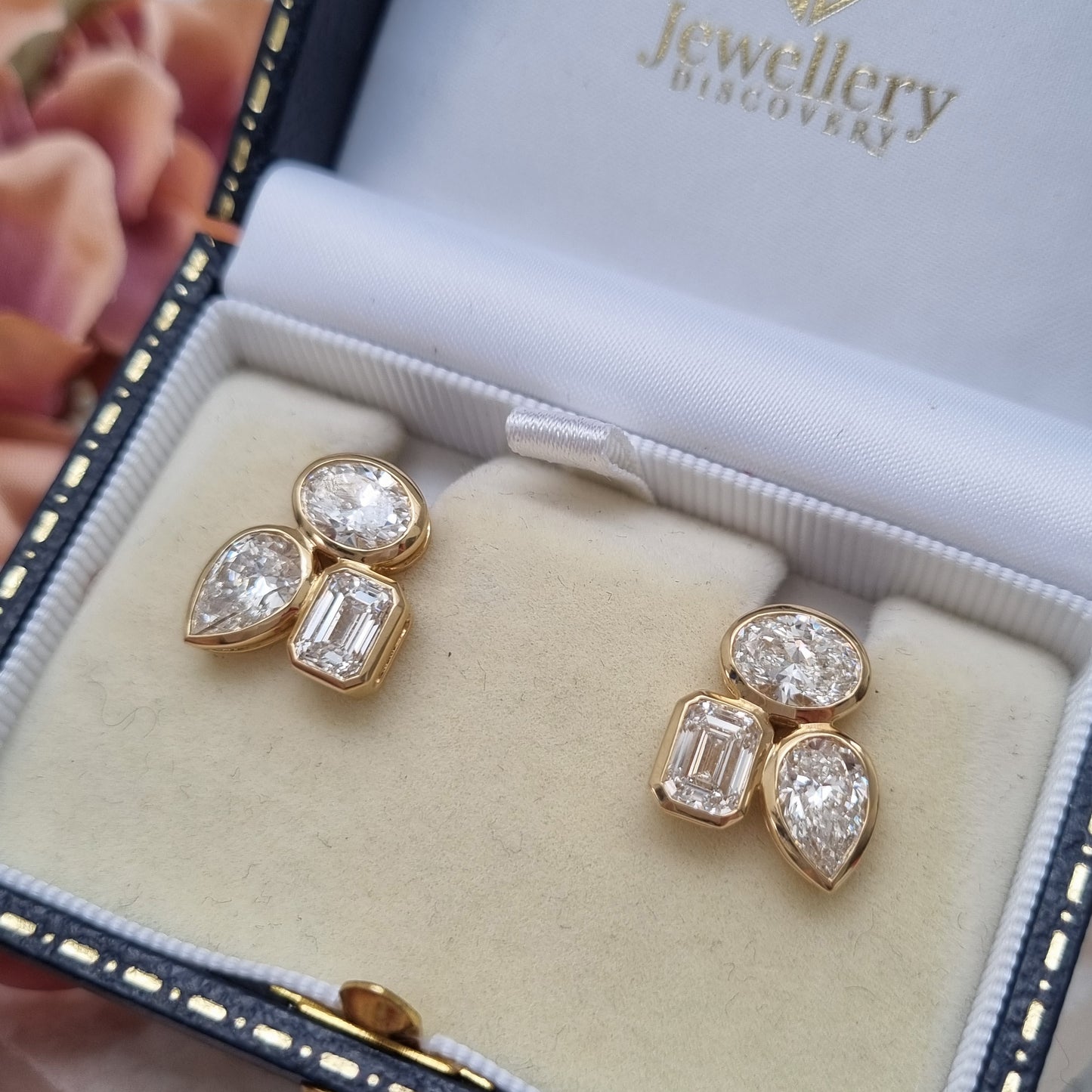 Fine Pair of Pear Oval and Emerald Cut Diamond Earrings