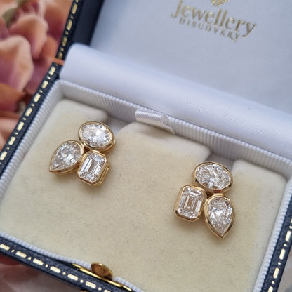 Fine Pair of Pear Oval and Emerald Cut Diamond Earrings