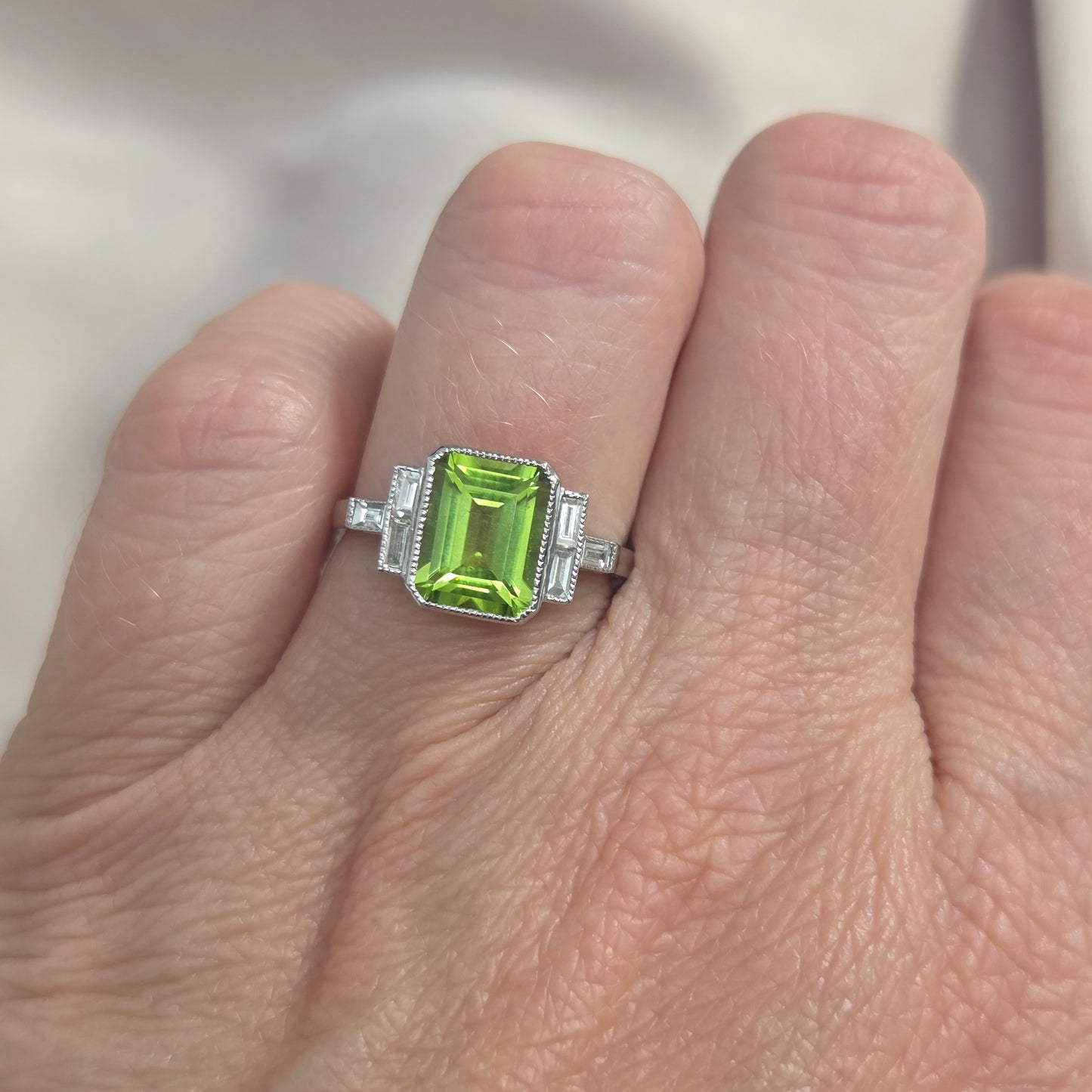 2.60ct Emerald Cut Peridot Ring with Baguette Diamonds in Platinum