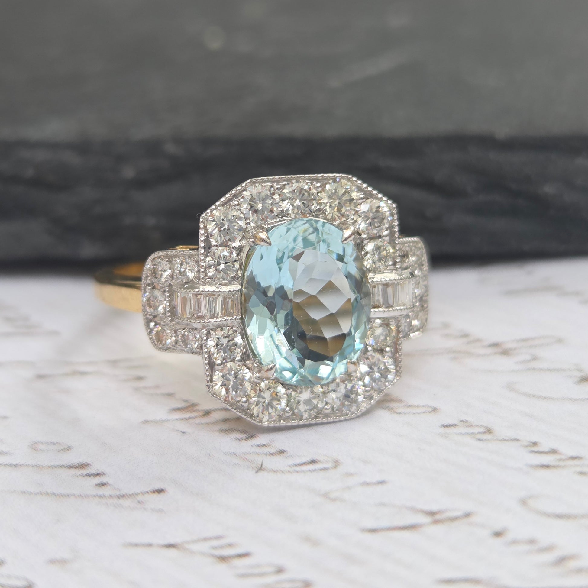 1.64ct Oval Aquamarine and Diamond Cluster Dress Ring with Buckle Shoulders