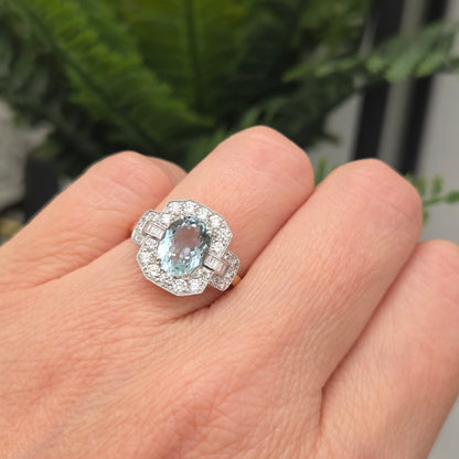 1.64ct Oval Aquamarine and Diamond Cluster Dress Ring with Buckle Shoulders