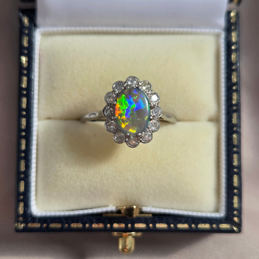 Edwardian Antique Black Opal and Old Cut Diamond Cluster Engagement Ring in Platinum