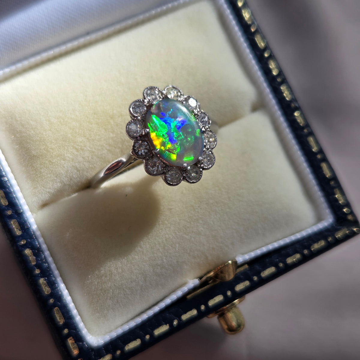Edwardian Antique Black Opal and Old Cut Diamond Cluster Engagement Ring in Platinum