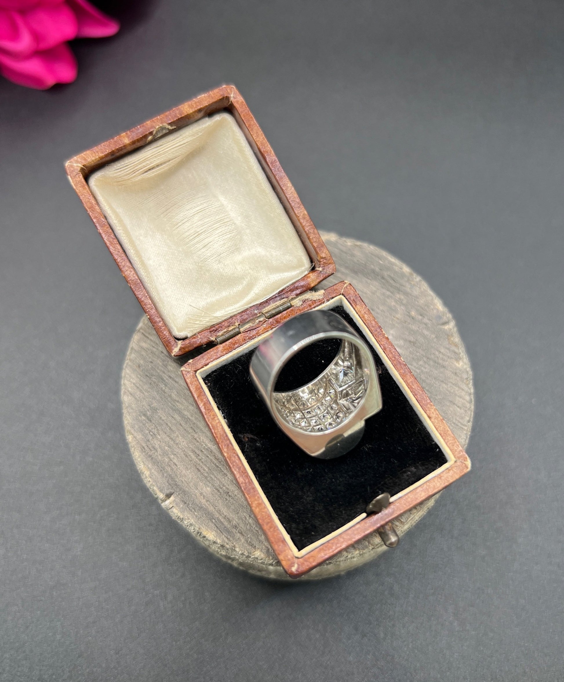 A round diamond tank style cocktail ring in platinum, in a ring box