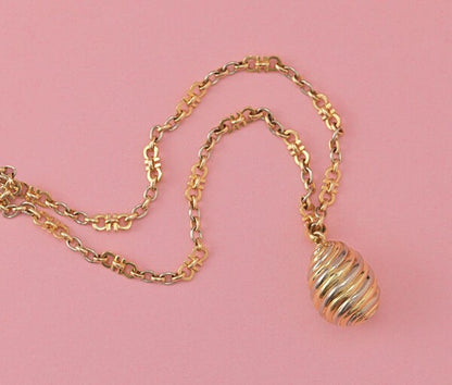 Cartier Tri Colour Gold Fancy Link Chain with Pendant; links comprising of two Cartier C’s, alternated with oval white, rosé and yellow gold links, rosé gold lock. Signed and numbered