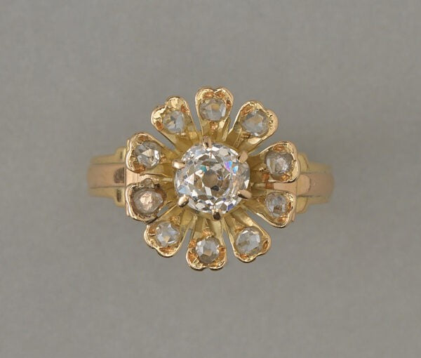 Antique Edwardian Old Cut Diamond Flower Ring; central 0.67ct old cut diamond, rose-cut diamond set petals, 1.07 carat total, 18ct yellow gold, France, circa 1910