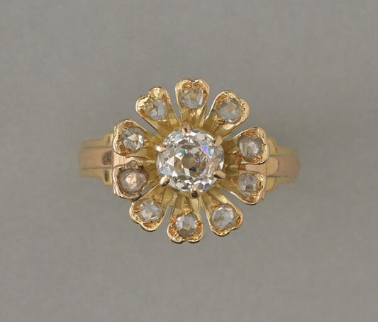 Antique Edwardian Old Cut Diamond Flower Ring; central 0.67ct old cut diamond, rose-cut diamond set petals, 1.07 carat total, 18ct yellow gold, France, circa 1910