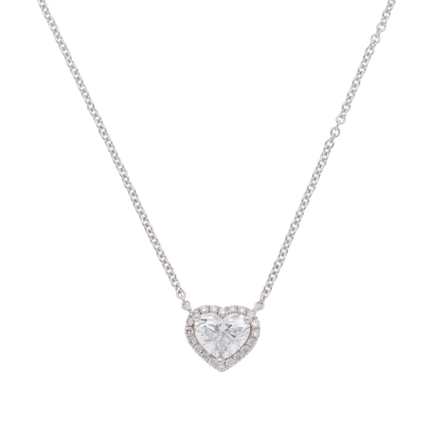 A heart shaped diamond cluster pendant on a white gold chain, on a white background