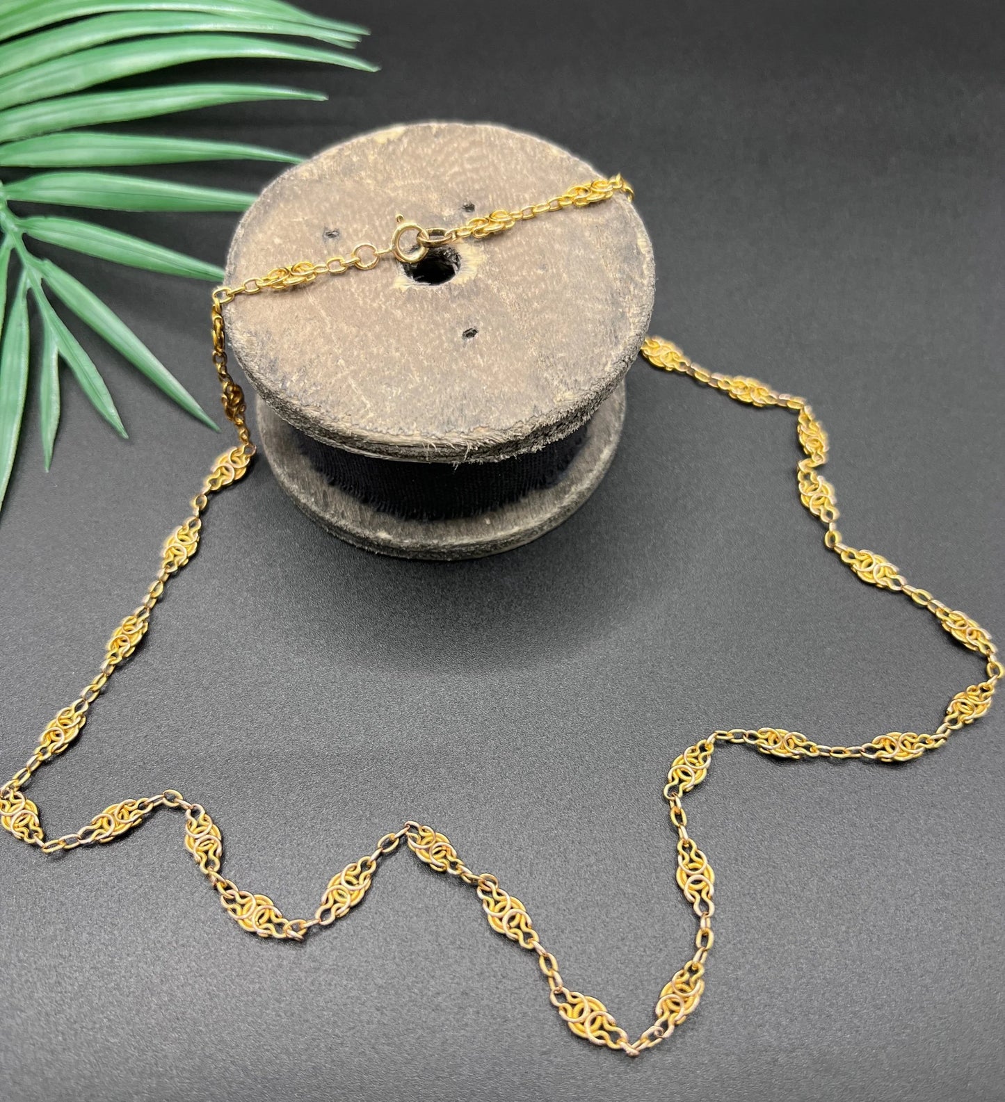 A yellow gold fancy link chain necklace