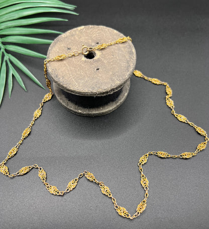 A yellow gold fancy link chain necklace