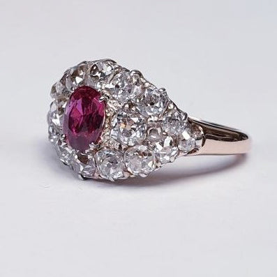 Victorian Antique 1.25ct Siamese Ruby and 3ct Old Mine Cut Diamond Domed Navette Cluster Dress Ring in 18ct yellow gold. Circa 1890