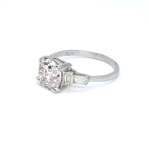 2.16ct Diamond Solitaire Engagement ring, baguette-cut diamond set shoulders, mounted in platinum