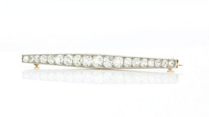 Art Deco Old Cut Diamond Bar Brooch; set with 1.20 carats of graduating old-cut diamonds. Mounted in platinum and backed with 18ct yellow gold. Circa 1920s