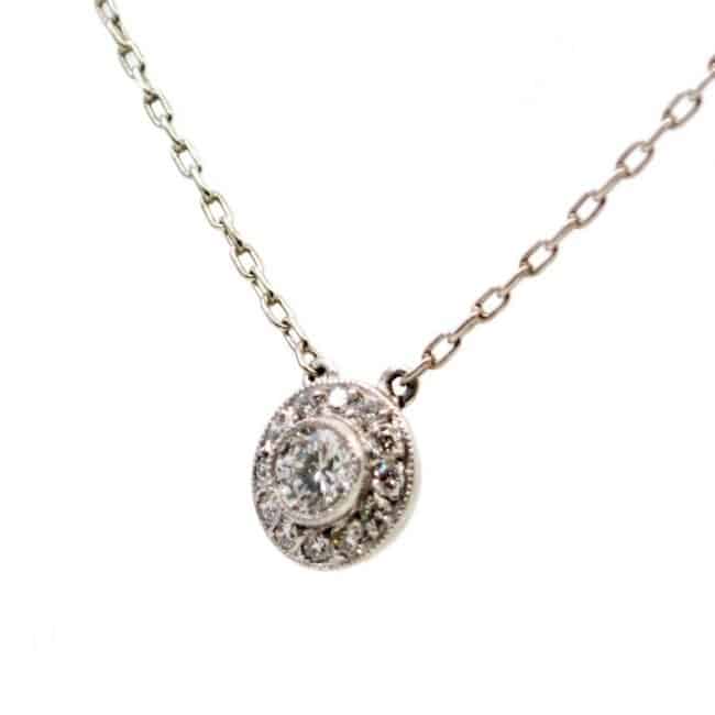 Vintage Art Deco Style Diamond and Platinum Cluster Pendant Necklace, 0.35 carat total, with chain.