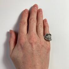 Retro Diamond and Platinum Cocktail Ring; designed as a dome with curved and flaring ridges, set with 2.55 carats round brilliant cut and baguette diamonds