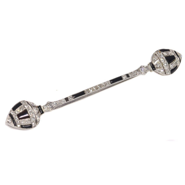 Art Deco diamond and onyx bar brooch in white gold.