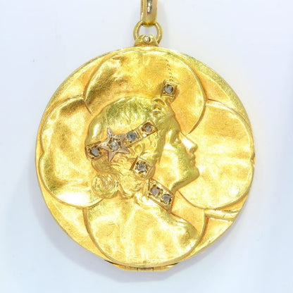 Art Nouveau Four Leaf Clover Locket Pendant with Rose Cut Diamonds; four-leaf clover design crafted from 18ct yellow gold, accented with the profile of a lady's head decorated with eight rose-cut diamonds, Circa 1900