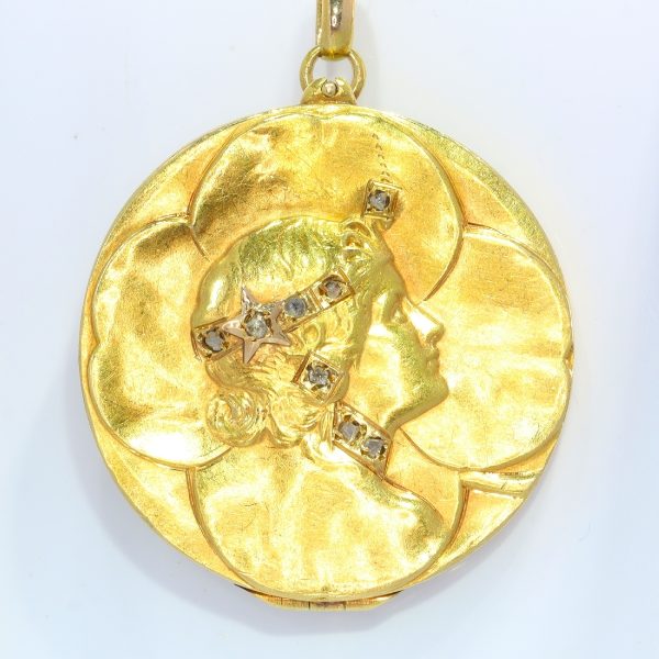 Art Nouveau Four Leaf Clover Locket Pendant with Rose Cut Diamonds; four-leaf clover design crafted from 18ct yellow gold, accented with the profile of a lady's head decorated with eight rose-cut diamonds, Circa 1900