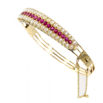 Antique Victorian 2.20ct Ruby and Pearl Bangle Bracelet in 14ct Gold, late 19th century Circa 1880