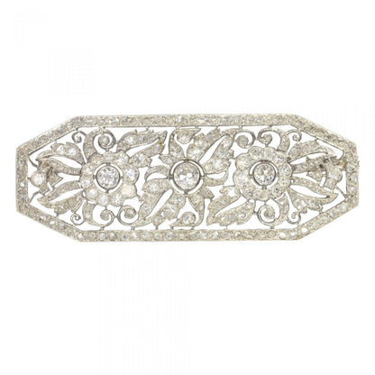 Art Deco French 1.40ct Diamond Brooch in Platinum; openwork floral design design set with over 1.40 carats of old-cut, single-cut and rose-cut diamonds. Mounted in platinum and 18ct white gold. Circa 1920