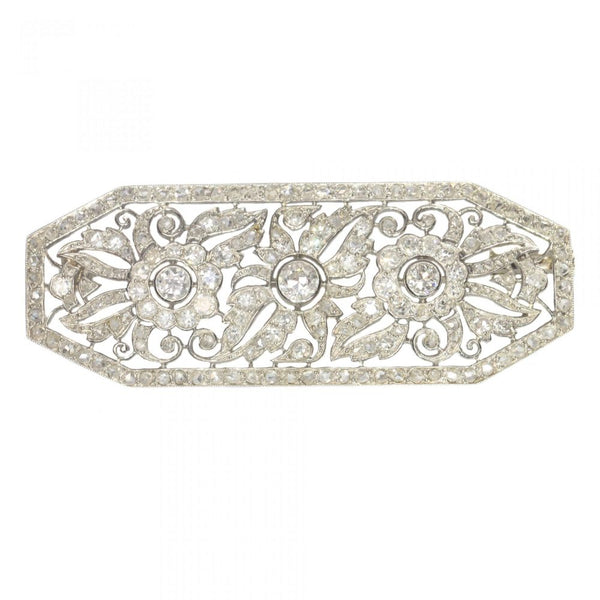 Art Deco French 1.40ct Diamond Brooch in Platinum; openwork floral design design set with over 1.40 carats of old-cut, single-cut and rose-cut diamonds. Mounted in platinum and 18ct white gold. Circa 1920