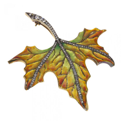 Vintage Autumn Leaf Enamel Brooch with Diamonds; 18ct yellow gold leaf brooch decorated with green yellow and orange enamel, the stem and main veins set with 1.73 carats of diamonds. Circa 1970