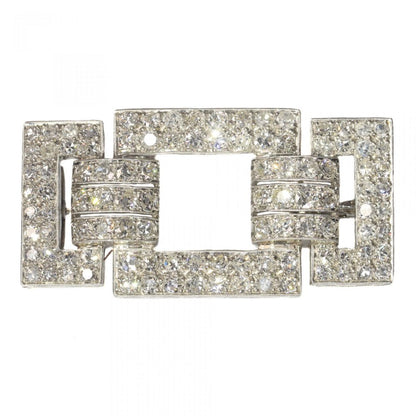 Art Deco Platinum and Diamond Brooch; bold geometric platinum brooch set with just over 4 carats of old mine-cut and single-cut diamonds. Circa 1920