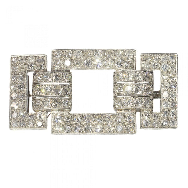 Art Deco Platinum and Diamond Brooch; bold geometric platinum brooch set with just over 4 carats of old mine-cut and single-cut diamonds. Circa 1920