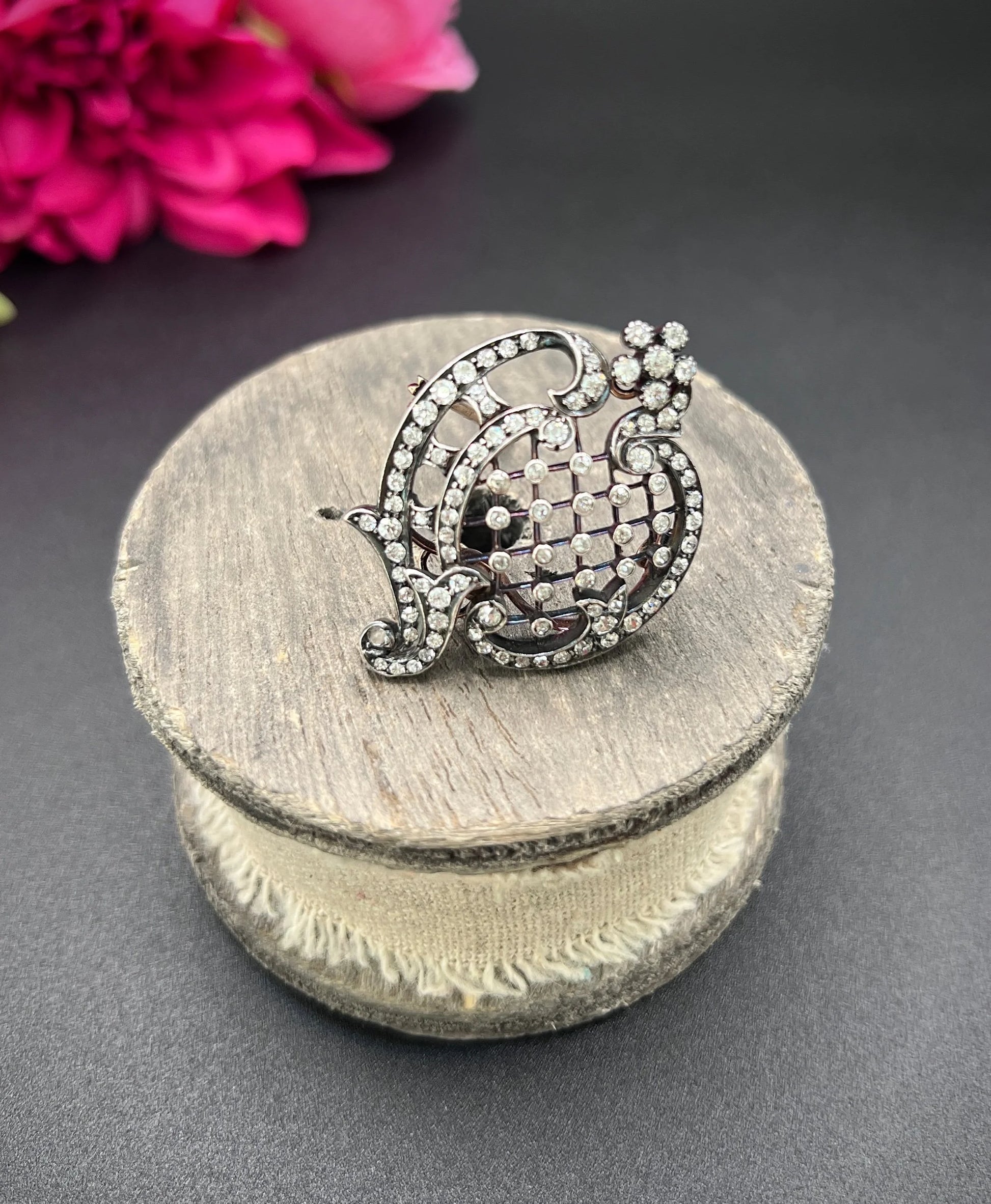 An openwork diamond set antique brooch in yellow gold and silver