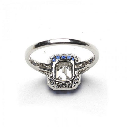 0.69ct Emerald Cut Diamond and Sapphire Cluster Ring, E VS2, Square-cut diamond set shoulders, mounted in platinum