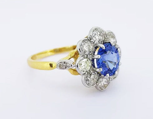 Vintage 1.70ct Natural Sapphire and Diamond Oval Cluster Ring; featuring a natural oval sapphire surrounded by 1.35cts brilliant cut diamonds, in 18ct gold.