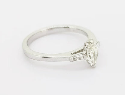 Marquise Cut Diamond Engagement Ring; set with a 0.45ct marquise-cut diamond flanked by 0.13ct baguette-cut diamond set shoulders, 18ct white gold.