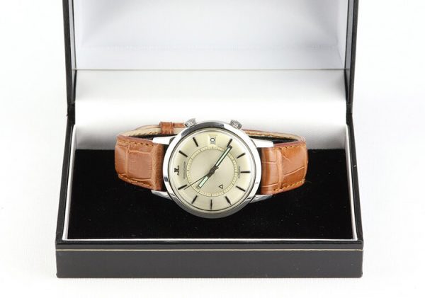 Vintage Jaeger LeCoultre Memovox Alarm 37mm Stainless Steel Automatic Watch, silver dial with date indicator and alarm function, on a brown leather strap with Jaeger-LeCoultre steel pin buckle, Circa 1950s