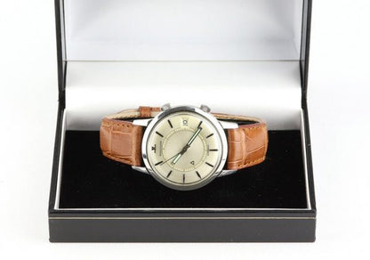 Vintage Jaeger LeCoultre Memovox Alarm 37mm Stainless Steel Automatic Watch, silver dial with date indicator and alarm function, on a brown leather strap with Jaeger-LeCoultre steel pin buckle, Circa 1950s