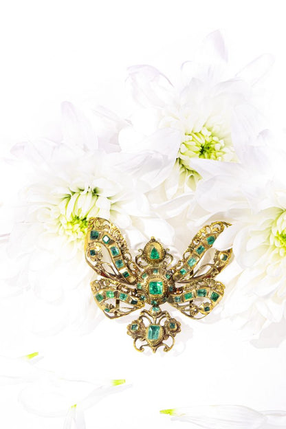 Museum Exhibited Baroque Emerald Bow Pendant In 18 Carat Yellow Gold