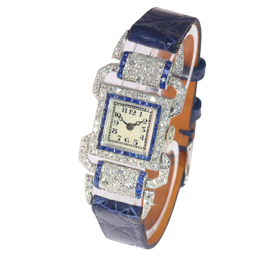 A ladies Art Deco design cocktail wristwatch set with diamonds and sapphires, on a blue leather strap
