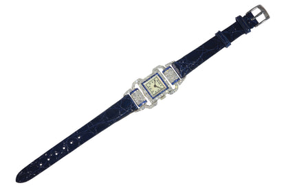 A ladies Art Deco design cocktail wristwatch set with diamonds and sapphires, on a blue leather strap