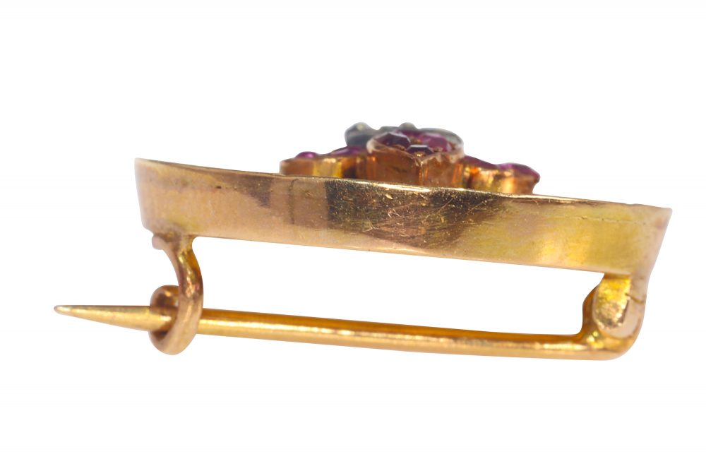 Late 19th century Gold Brooch with Burmese Ruby and White Enamel Fleur de Lis