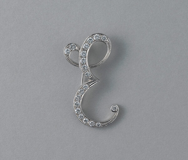 Diamond and 18ct White Gold E Brooch; depicting the initial capital E set with brilliant cut diamonds, 2.00 carat total, Could be converted into a pendant